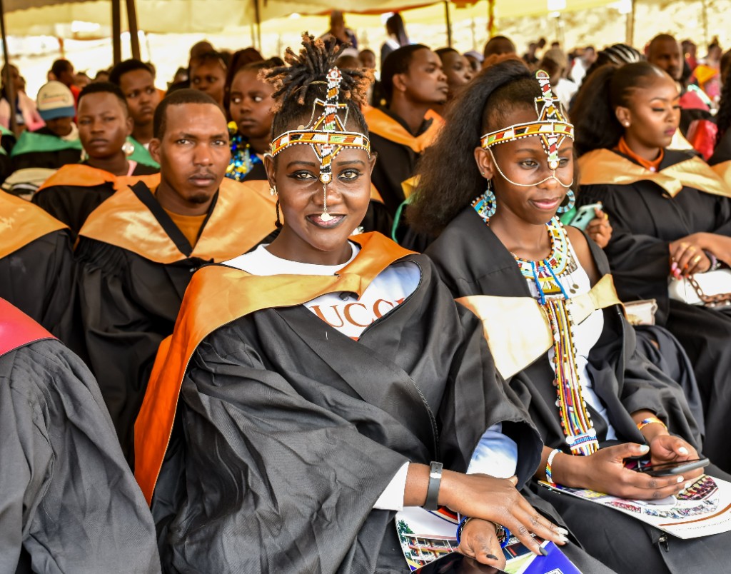 MMTVC graduates in academic gowns with traditional Maasai beadwork — where education meets culture